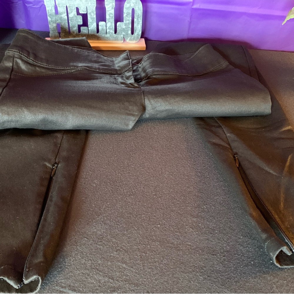 Denim skinny jeans with black shiny coating.